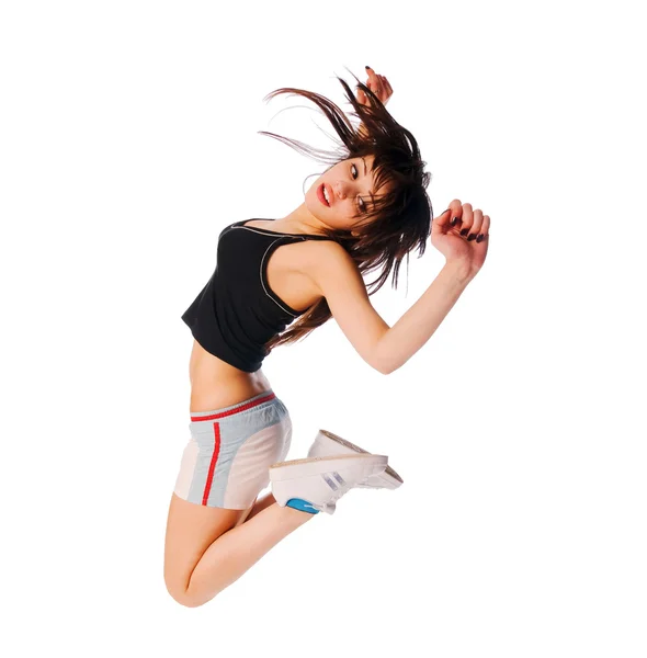 Aufgeregtes junges Mädchen springt auf Weiß — Stockfoto