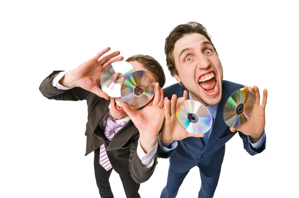 Två glada affärsmän erbjuder DVD-skivor till försäljning — Stockfoto