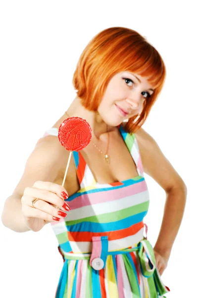 Beautiful red girl with candy — Stock Photo, Image