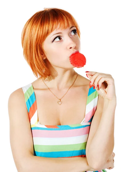 Красива червона дівчина з цукерками — стокове фото