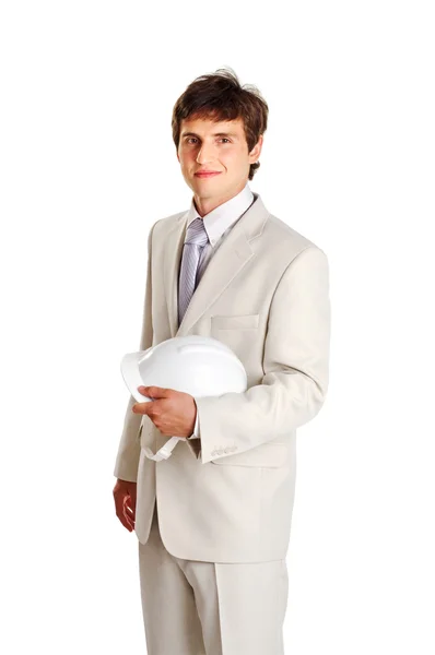 Bello giovane uomo con hardhat su bianco — Foto Stock