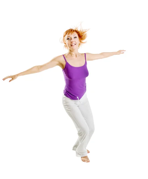 Red haired girl performing fitness exercises — Stock Photo, Image