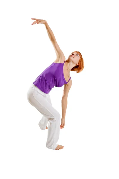Red haired girl performing fitness — Stock Photo, Image