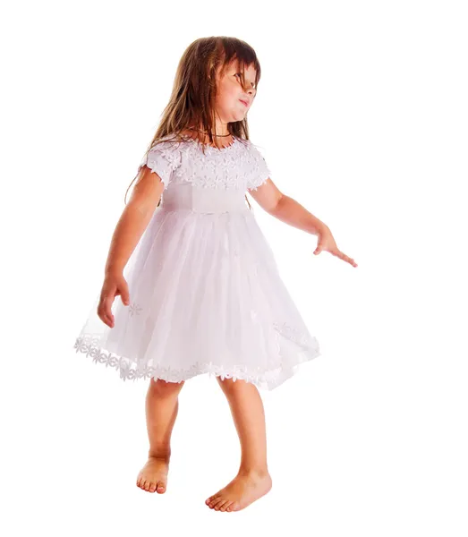 Malá dívka, která nosí šaty na bílém pozadí — Stock fotografie
