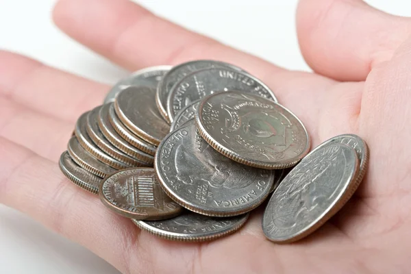 25 cêntimos quartos de moedas de modificação em uma mão — Fotografia de Stock