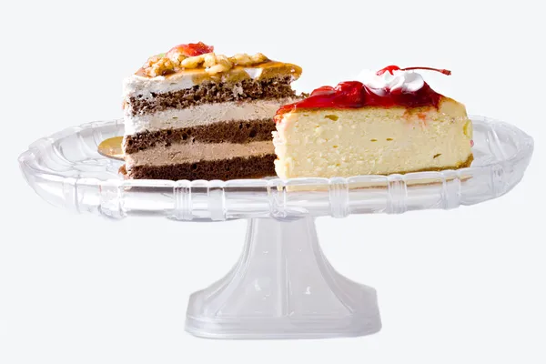 Bolo de queijo e sobremesas de bolo de chocolate — Fotografia de Stock