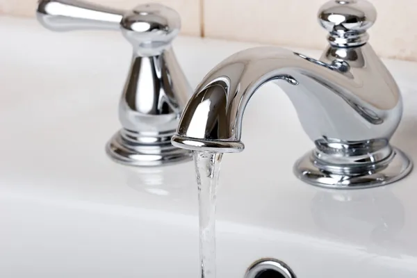 Chrome bathroom tap faucets Stock Image