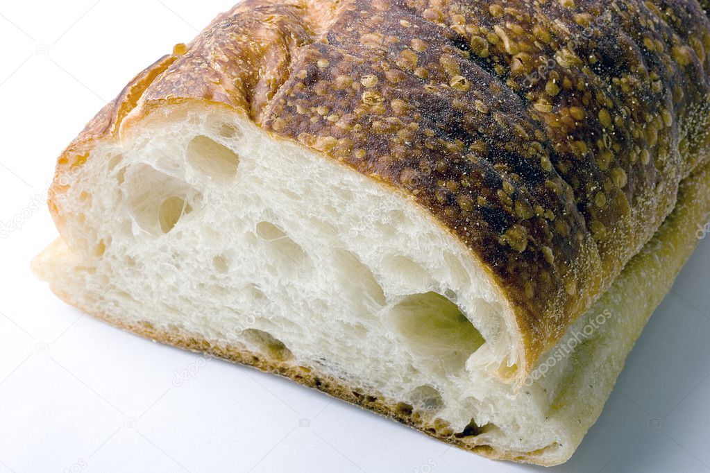 Stock photo - slice of white Italian brick oven delicious fresh baked bread with crunchy crust