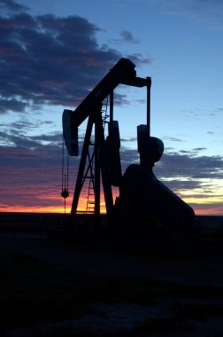 Oil well at Sunrise clipart