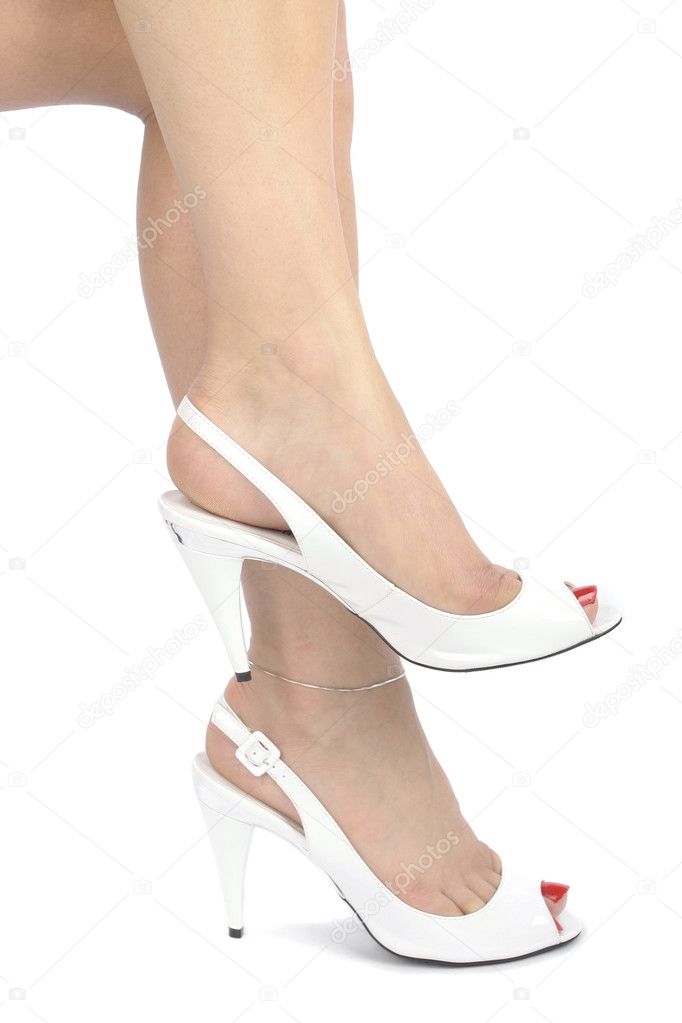 Woman wearing white high heels