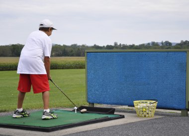 At the driving range clipart