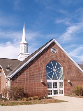 Exterior of a modern red brick church clipart