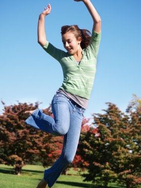 Teenage girl jumping in the air clipart