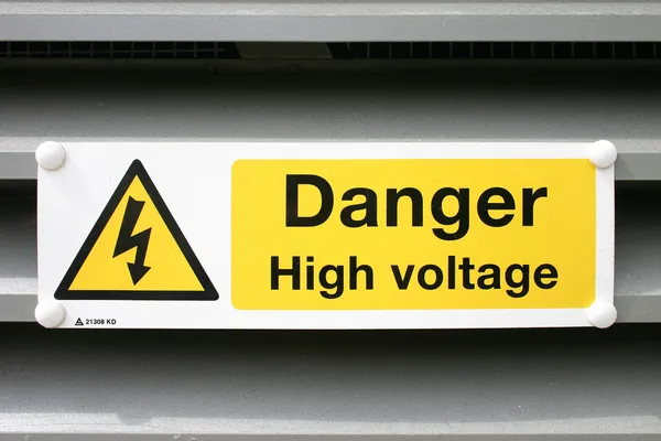 Nebezpečí elektrický nápis Stock Snímky