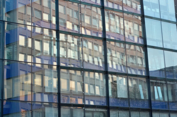 Windows reflected in windows of an opposite building