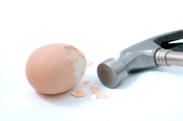 stock image Egg crushed by hammer