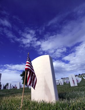 Grave Marker of Soldier with American Flag in a clipart