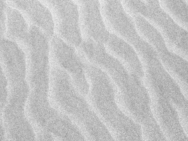 Абстрактный фон песчаных рябин на пляже — стоковое фото