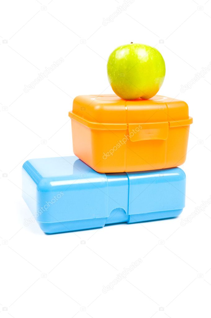 Colorful lunchboxes with green apple