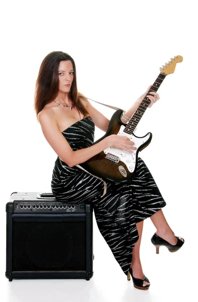Sexy brunette with a guitar — Stock Photo, Image