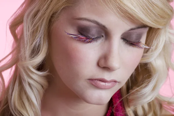 Woman wearing feather eye lashes — Stock Photo, Image