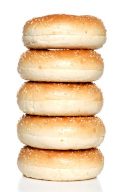 Isolated stack fresh sesame seed bagels clipart