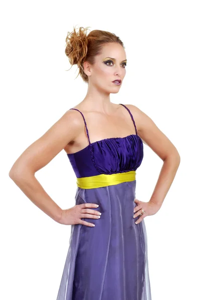 Woman wearing purple dress hands on hip — Stock Photo, Image