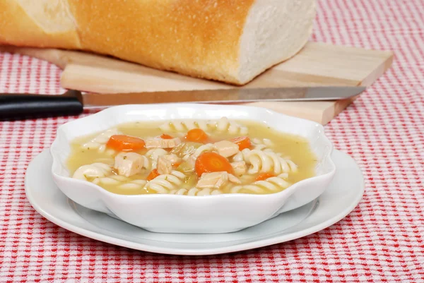 Chicken pasta soup fresh baked bread — Stock Photo, Image