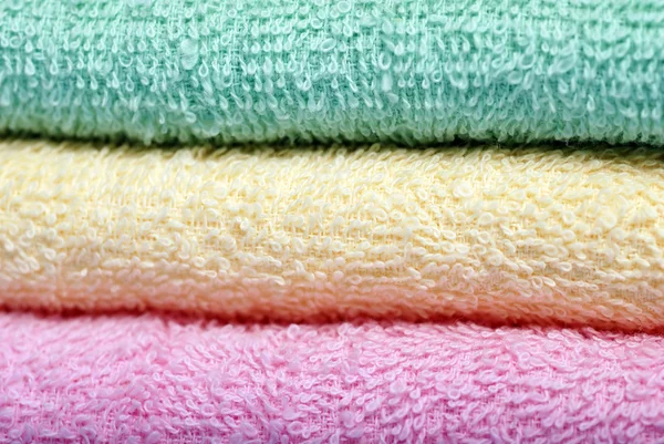 Green yellow pink towels — Stock Photo, Image