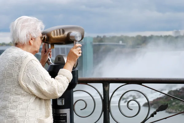 stock image Senior tourist binoculars niagara falls