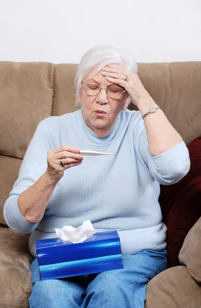 Senior with a fever — Stock Photo, Image