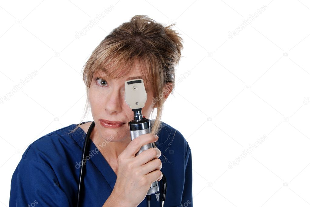 Middle aged Female Doctor doing eye exam