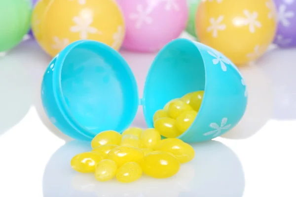 Spilling yellow jelly beans shallow DOF — Stock Photo, Image