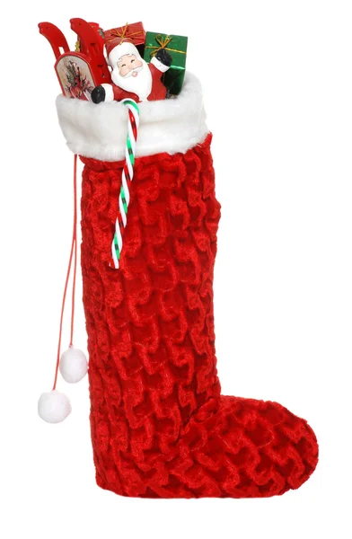 Vánoční ponožka plná hraček cukroví — Stock fotografie