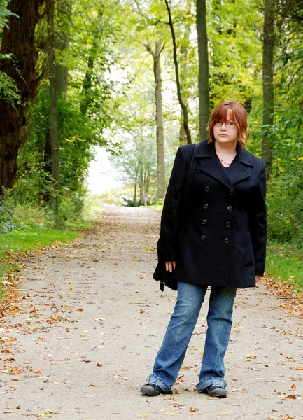 stock image Female teenager on a forest path