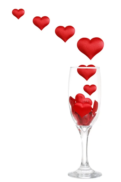 Champagne glass with hearts floating up — Stock Photo, Image