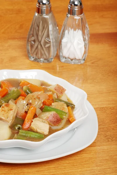 Chicken stew with salt and pepper — Stock Photo, Image