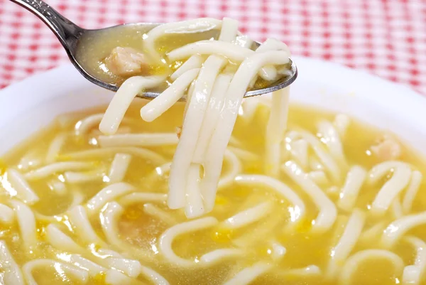 Closeup spoonful chicken noodle spoon — Stock Photo, Image