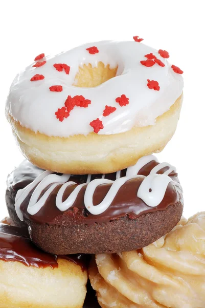 Closeup stapel geassorteerde donuts — Stockfoto