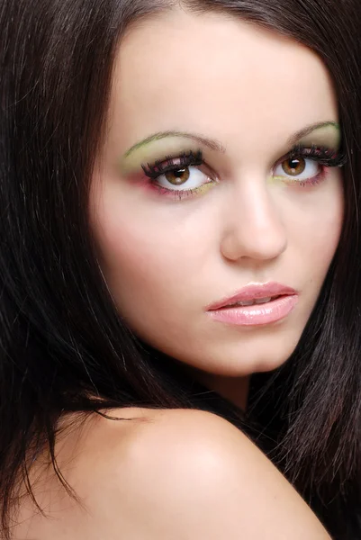 Closeup mulher vestindo rosa e verde olho — Fotografia de Stock