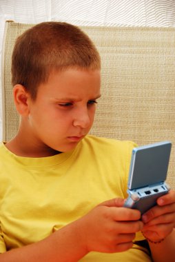 Child Playing Video Game clipart