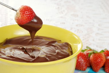 Melted chocolate and strawberry fondue clipart