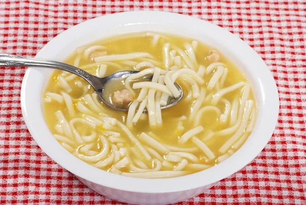 Chicken noodle soup with spoon — Stock Image Chicken noodle soup with spoon Stock Picture