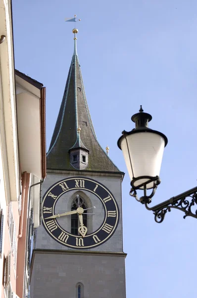 stock image Clock face and street lamp