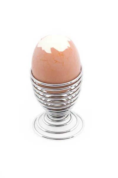 stock image An eggcup with a pealed egg on it