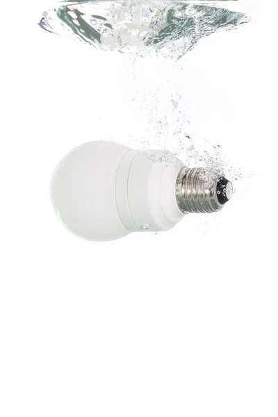 A lightbulb falling in the water — Stock Photo, Image
