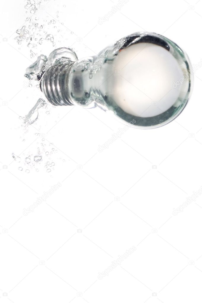 A light bulb falling into clear water