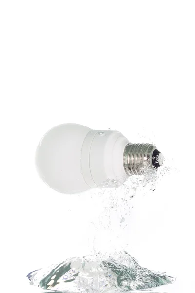 Alight bulb jumping out of the water — Stock Photo, Image