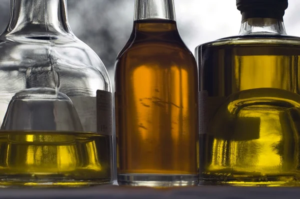 Three bottles of olive oil Stock Photo