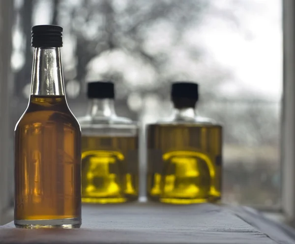 Three bottles of olive oil Stock Picture